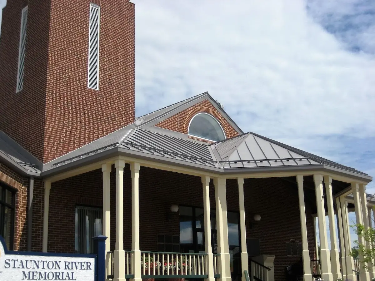 Skilled roofing craftsmen working on a residential roof in Oldham Pines